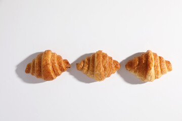 Croissant isolated in  wihite background with sunny light