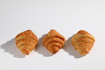Croissant isolated in  wihite background with sunny light