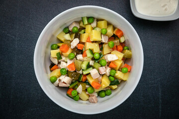 Delicious salads on a dark table
