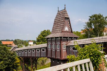 Wonderful covered wooden bridge by Dusan Jurkovic in Italian garden, baroque park in sunny summer...