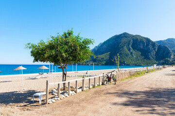 Morning on the beach in the village of Cirali. Blue bay in the Mediterranean at dawn. Landscapes of the Lycian Trail.