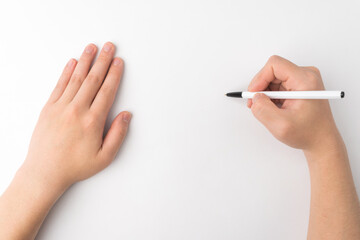 hand holding a pen on a white background
