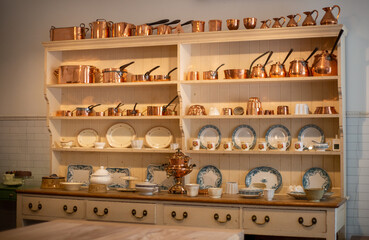 Vintage copper cookware in kitchen cabinet in Wyoming 