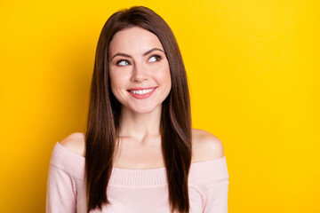 Photo of optimistic brunette lady look empty space wear pink shirt isolated on vibrant yellow color background