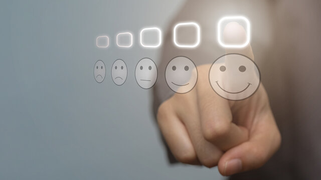 Customer Experience Concept, Businessman pressing smiley face emoticon on virtual touch screen. new technology bigdata and business process strategy, Automate operation.