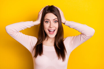 Fototapeta premium Photo of impressed brunette lady hands head wear pink shirt isolated on yellow color background