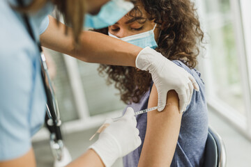 Teenager Girl Getting Vaccinated Due To Covid-19
