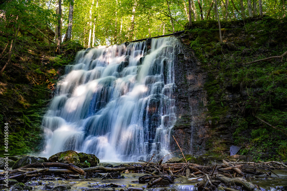 Wall mural silverfallet staircase waterfall nature reserve in lush serene forest and rural mill environment nea