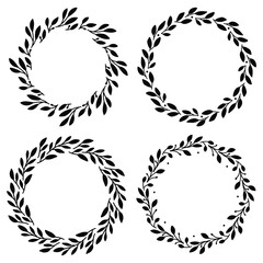 Set of 4 hand drawn spring wreaths isolated on white background, vector. Silhouette circle of leaves. Doodle style.Collection of floral frames.