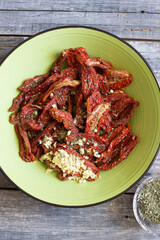 dried tomatoes dressed with garlic, oregano and oil.