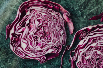 sliced red cabbage on a green table