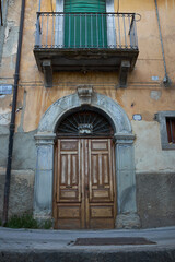 Fototapeta na wymiar entrance doors of houses in typical country of Italy in the Mediterranean islands
