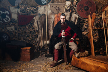 Obraz na płótnie Canvas Viking ancient weapon sword man warrior clothes