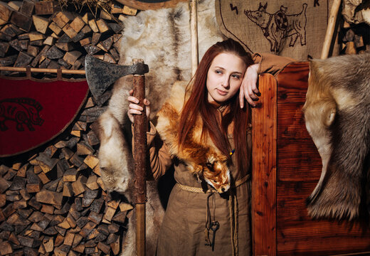 Viking woman posing ancient interior old scandinavian skin