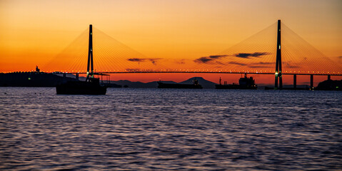 Fototapeta premium Early Morning view of 1,885m Russky Island Bridge in Russia, connects Russky Island with the city of Vladivostok. It is one of the longest cable-stayed suspension bridge in the world.
