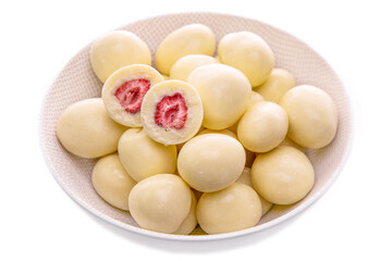 strawberries in white chocolate in a light plate on a white background. isolated foods in a white dish on a white background . Isolated items and products.