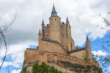 Fototapeta na wymiar Majestic detailed front view at the iconic spanish medieval castle palace Alcázar of Segovia