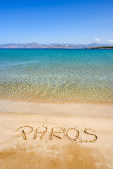 Santa Maria beach with golden sand, emerald waters and view on the island of Naxos. The best beach of Paros. Cyclades, Greece