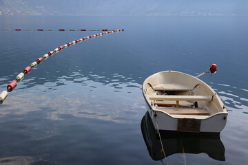 boat and buoys on the shore of the lake, Boko-Kotor bay, Montenegro
