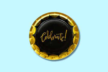 celebrate text on paper plate isolated on blue background for your holidays