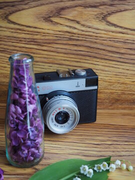 Old Photo Camera on the Table