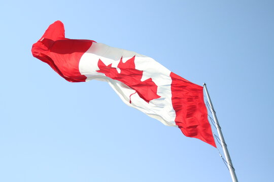 canadian flag on sky