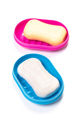 Travel soap in plastic soap dish isolated on white background