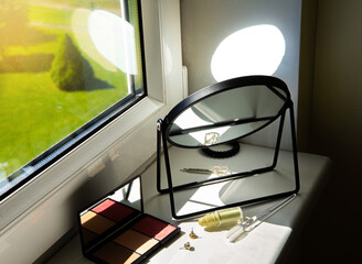 Harsh sunlight coming though window directly to mirror which can cause fire hazard at home concept.
