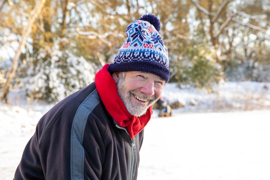 Smiling senior man in knit hat during winter