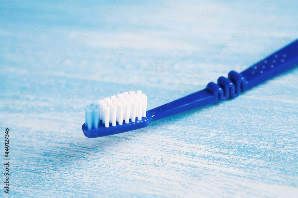 Wall mural toothbrush on a blue background