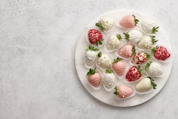 Fototapeta na wymiar Chocolate dipped strawberries mix on marble board