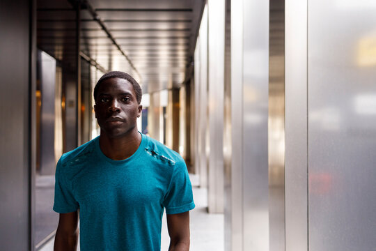 Handsome man standing in corridor