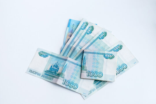light photo, on a white background, Russian money, one thousand, two thousand banknotes, money invested in a passport, credit, savings, savings, state, russia, pension, crumpled bill
