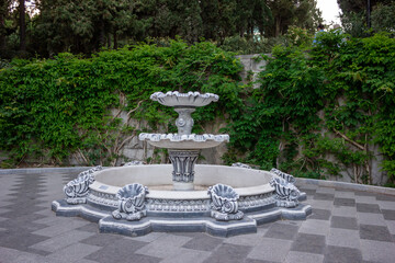 Fountain without water. The fountain is not working. Antique fountain.