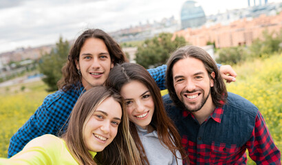 Long haired men with female friends in nature