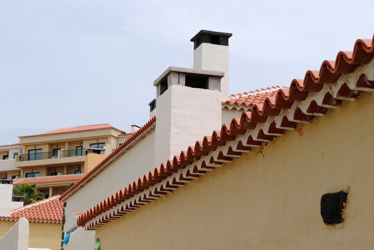 Detail of Roof Tiles on Traditional Stucco Building in Spanish Resort Village 