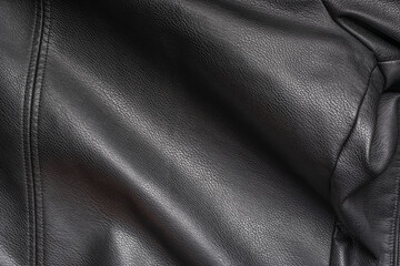 Fototapeta premium Closeup of black heavy leather material with deep texture, highlights and shade for design, texture background and displacement maps, with large canvas and copy space