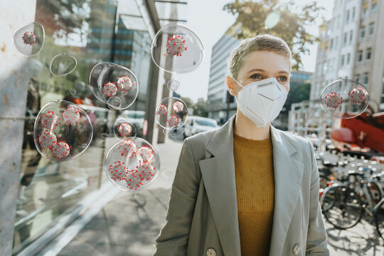 Woman with protective face mask amidst COVID-19 virus in city