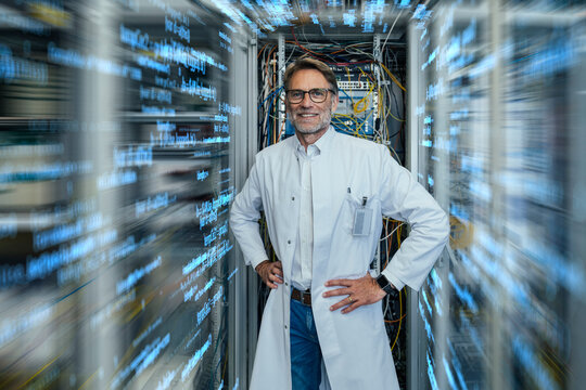 Server technician wearing lab coat standing amidst algorithms at data center
