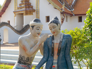 JAJA Krasip Rak or Poo Man Ya Man love romantic couple sculpture at Wat Phumin temple, Nan, Thailand. Famous tourist attraction. © tampatra