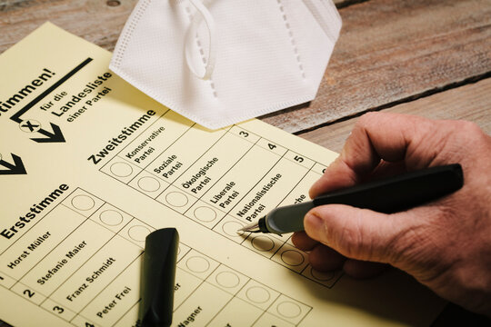 Ballot and pen on table with protective mask and corona rapid test