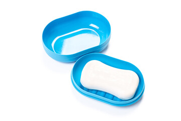 Travel soap in plastic soap dish isolated on white background