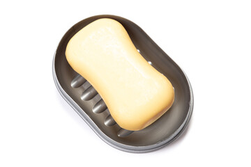 Travel soap in plastic soap dish isolated on white background