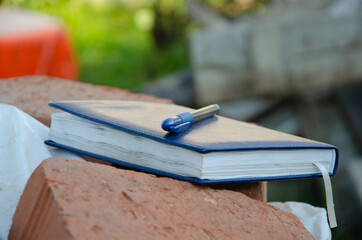 The text Study on a wooden cubes, lying on a Notepad with a metal blue pen. Business concept photo