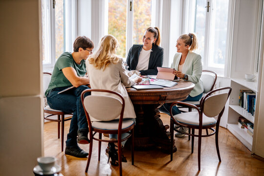 Event planners and customers discussing at office