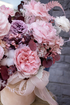 Preserved roses with dried flowers bouquet closeup. Eternal, stabilized, forever rose flower. Beautiful flowers.