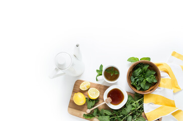 Mint tea with fresh mint leaves, lemon, and honey