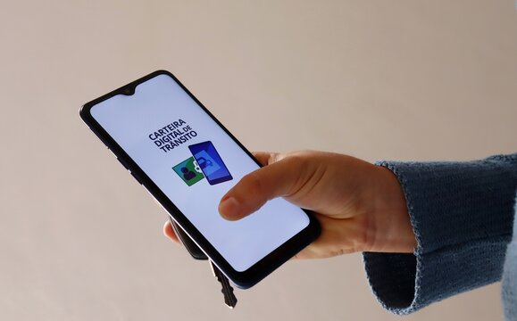 Carteira Digital de Transito app on smartphone screen. Brazilian digital driver&rsquo;s license.