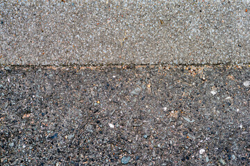 close up of light and dark asphalt road

