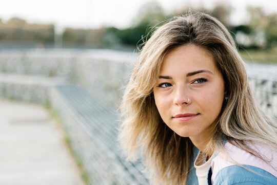 Beautiful blond woman looking away in skateboard park